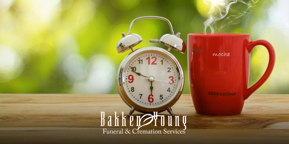 “Analog clock on a nightstand, symbolizing how the time change affects grief and routine”